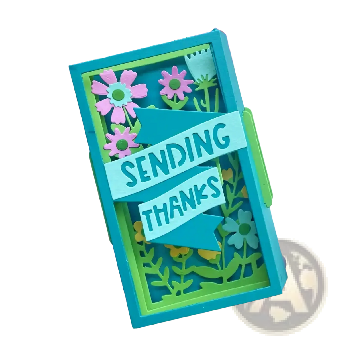 A vibrant turquoise and lime green layered paper card with pink floral cutouts and a teal sending thanks banner using flower cart metal cutting dies for diy crafts