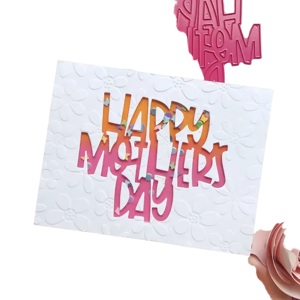 A white textured card with happy mothers day in layered pink die-cut letters filled with colorful confetti using Flower Cart metal cutting dies for diy crafts