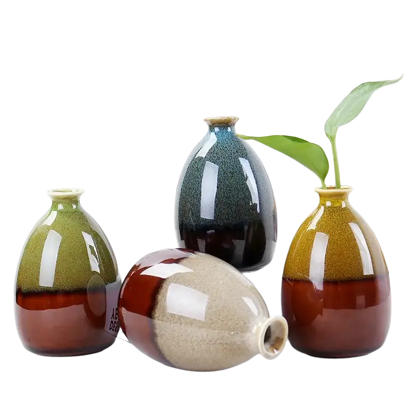 Four ceramic flower glaze vases with glossy two-toned glazes in green-brown, blue-black, mustard-yellow, and beige-red hues