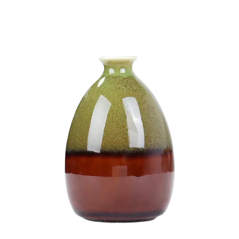 A glossy ceramic flower glaze vase with a gradient olive green to deep amber finish and a narrow neck for home decor