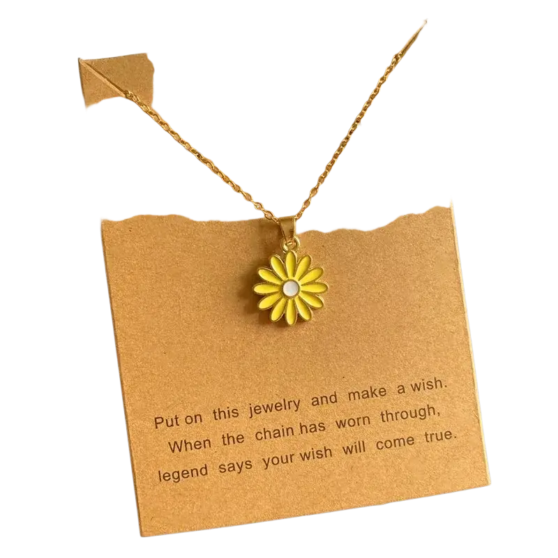 A delicate gold-toned flower pendant necklace with a bright yellow enamel daisy on a cute romantic link chain