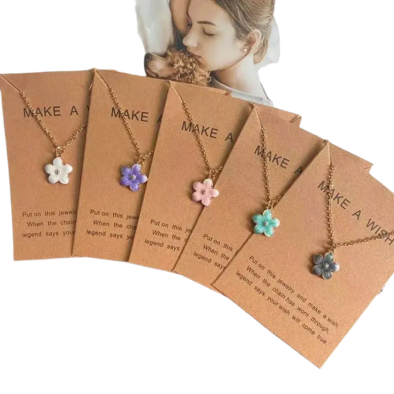 Five delicate gold-toned flower pendant necklaces with white purple pink turquoise and silver enamel on cute romantic link chains