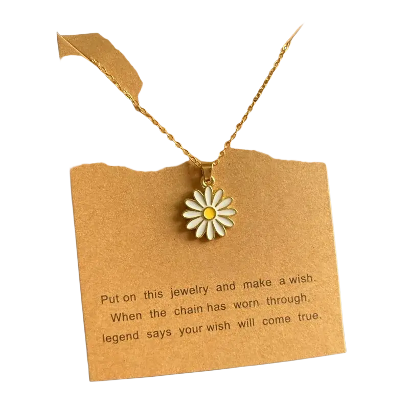 Gold-toned flower pendant necklace with white enamel petals and link chain for a cute romantic look displayed on brown card