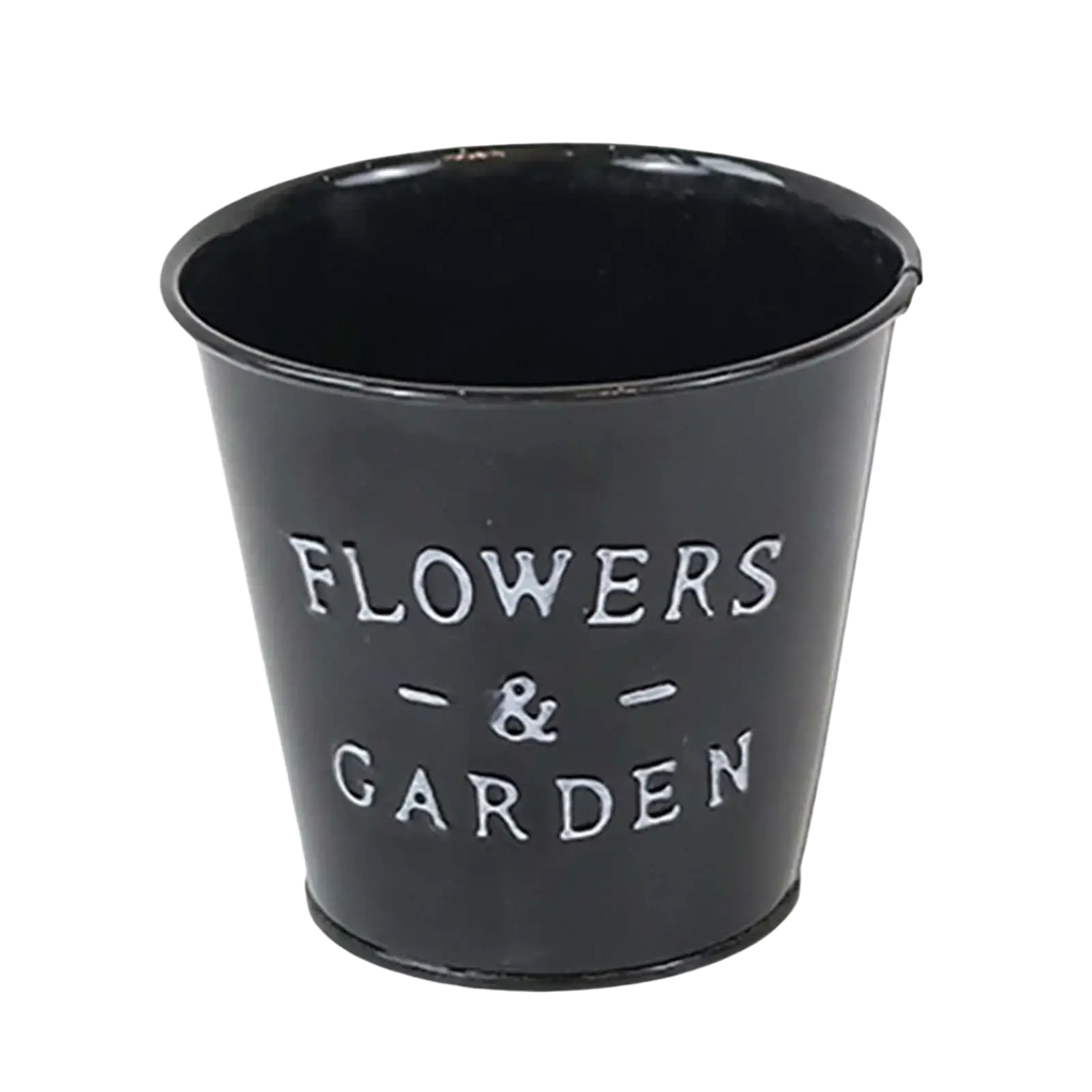 Black metal flower pot planter with flowers and garden engraved for rustic farmhouse garden plant use