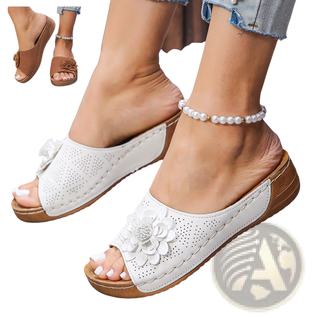 White leather flower wedge sandals with perforated design and large floral embellishment for retro beach style