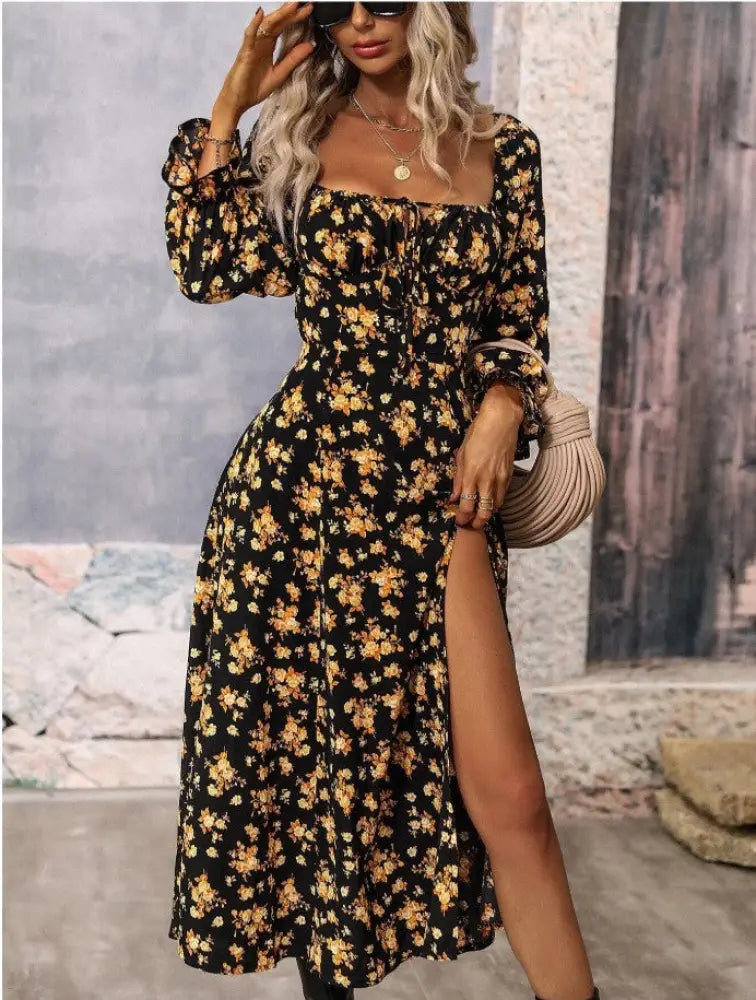 Black floral midi dress with long sleeves and square neckline featuring slit detail for elegant occasions