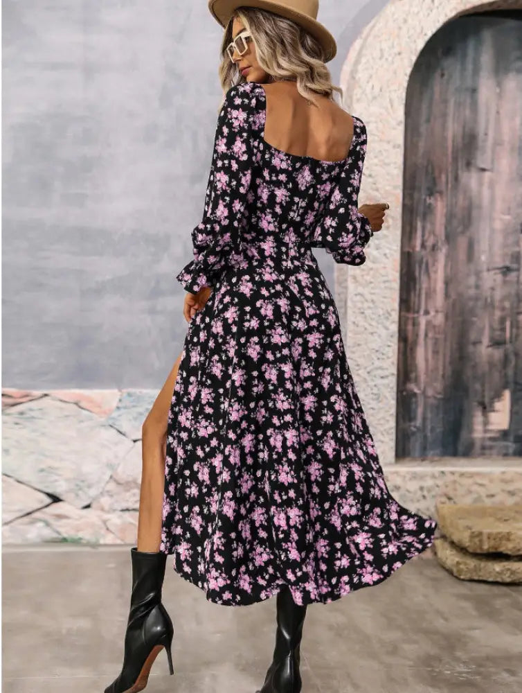 Black floral midi dress with pink blossoms long sleeves and square neckline featuring a slit detail