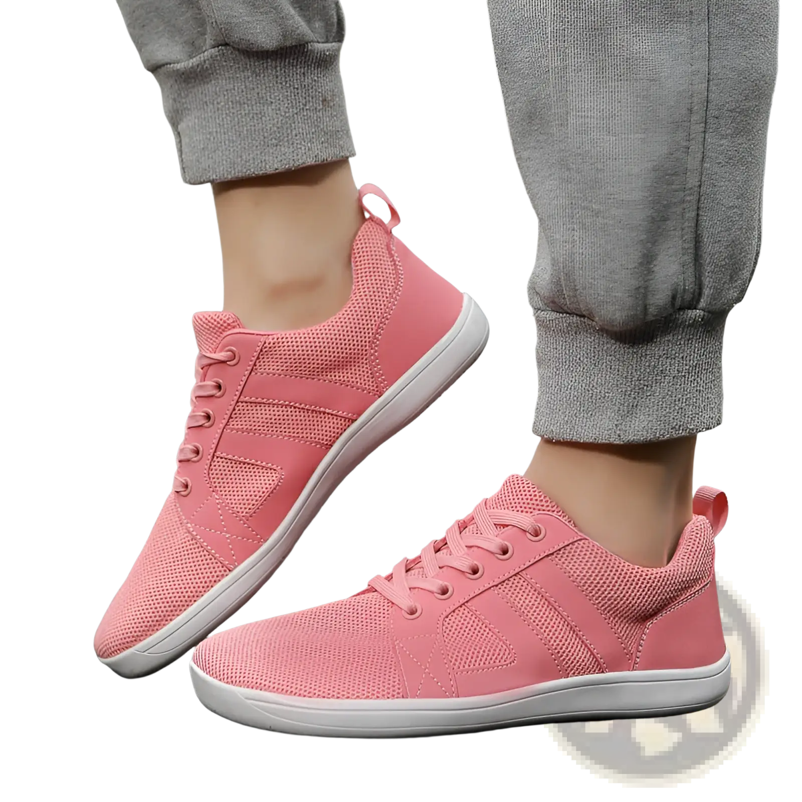 Pink fly-knit wide last breathable mesh sneakers with white soles and matching laces for comfortable wear
