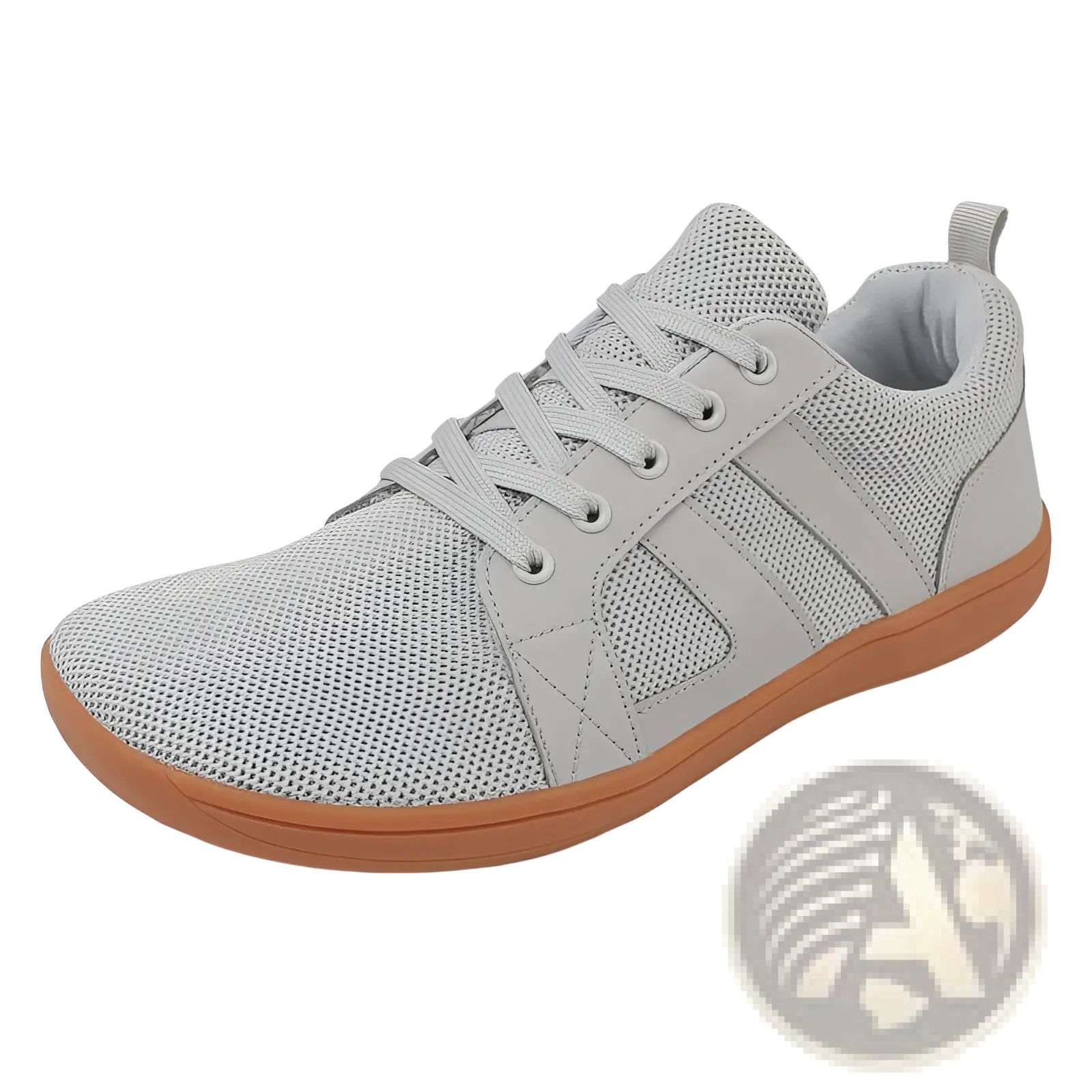 Light gray fly-knit wide last sneaker with breathable mesh upper and tan rubber sole featuring subtle stitched paneling