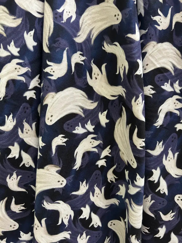 Flying ghosts navy blue retro pleated doris skirt with pockets featuring dark blue fabric with white cartoonish ghost pattern