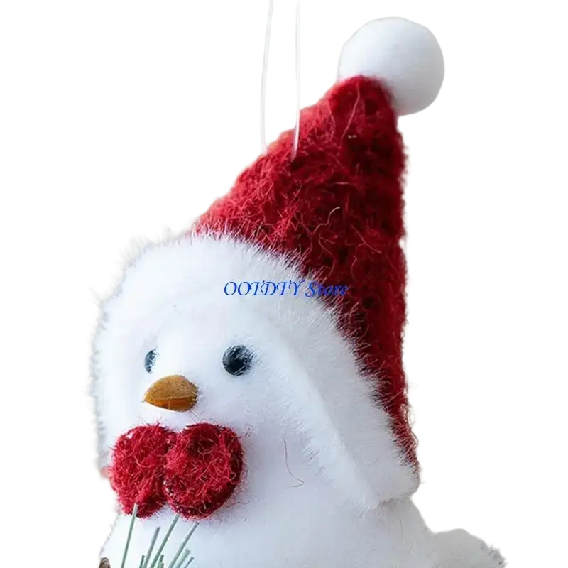 A fluffy white foam bird christmas ornament wearing a red santa hat and holding two red yarn hearts