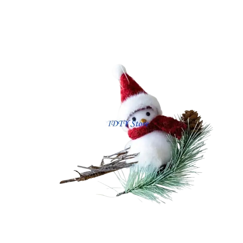 A plush white foam bird ornament wearing a red and white santa hat and scarf perched on a pine branch with pinecone