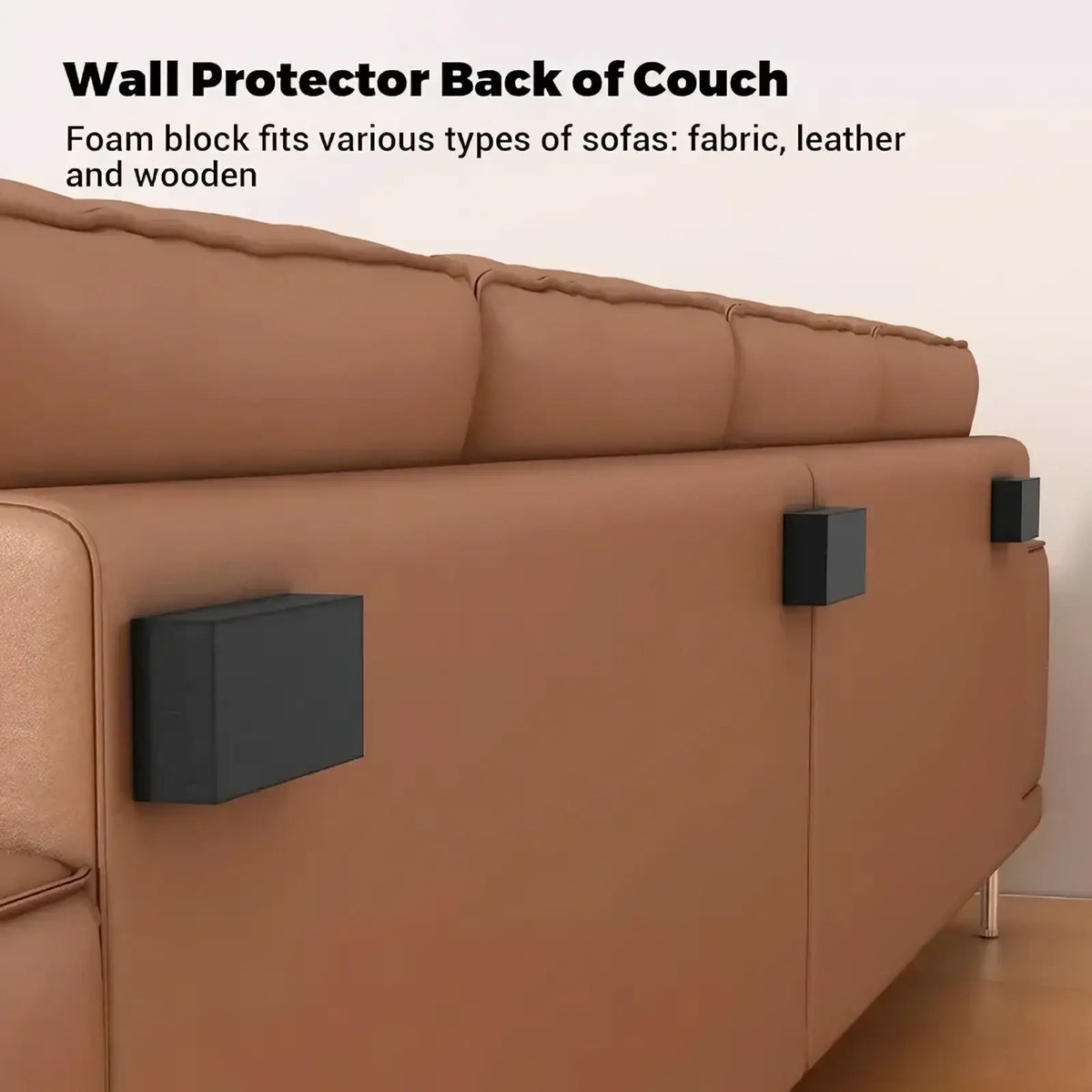 Black foam wall protectors self adhesive furniture pads attached to the back of a brown leather couch