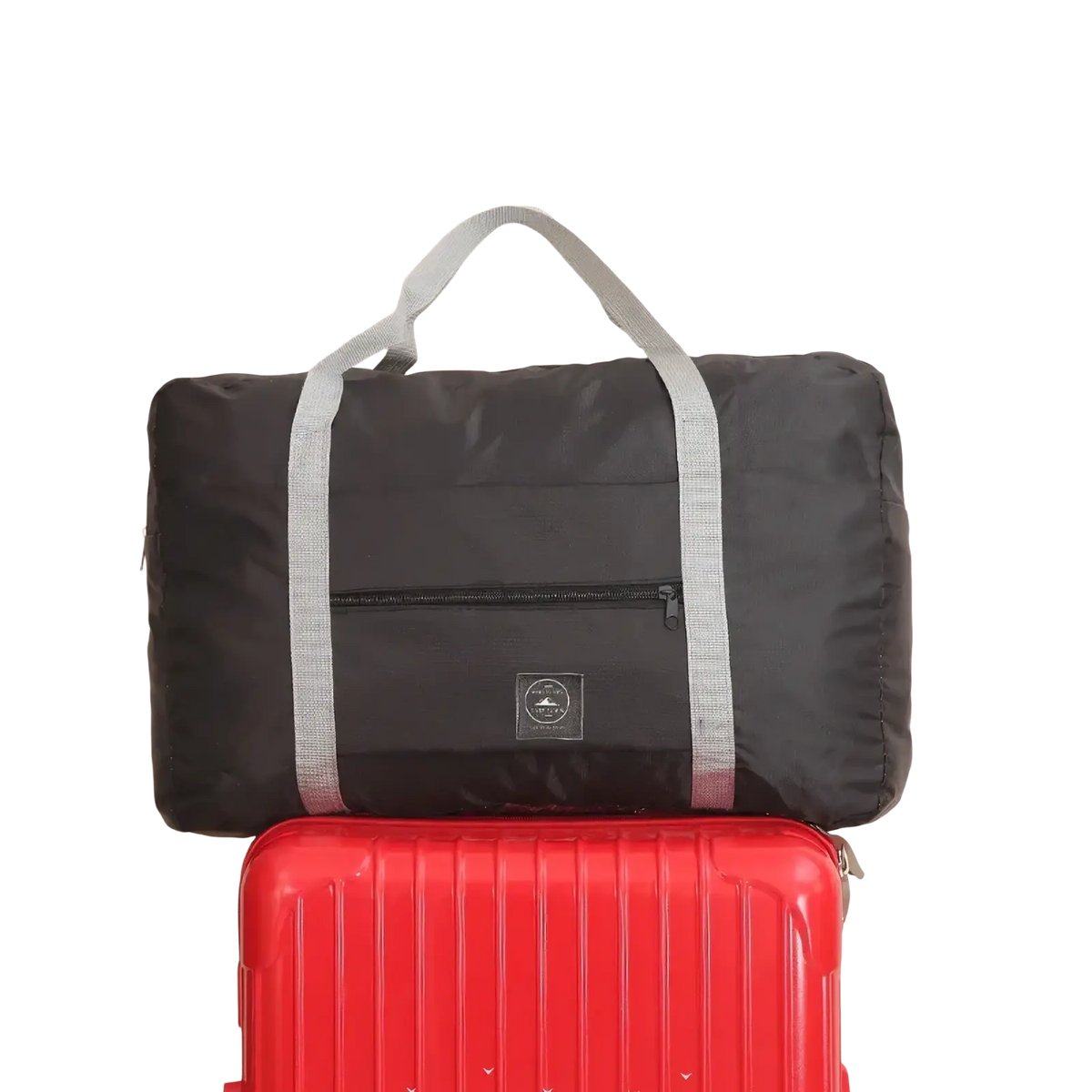 Black foldable canvas travel bag set with gray reflective straps and small circular logo patch for versatile use