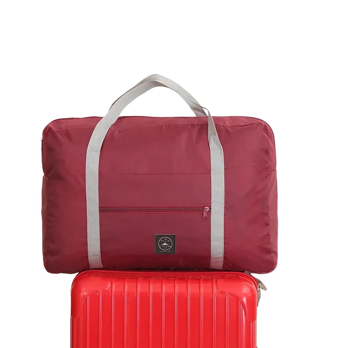 Maroon foldable canvas travel bag set with gray fabric handles and a small black logo patch for easy portability