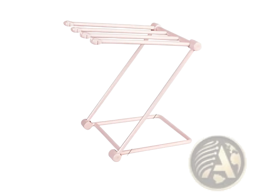 Pink metal foldable dishcloth rack with four horizontal bars and angled legs for kitchen towel organization
