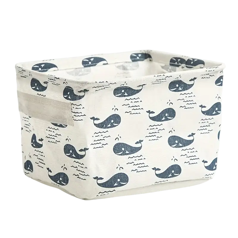 Foldable white fabric storage basket with navy blue whale print designed as a decorative storage box