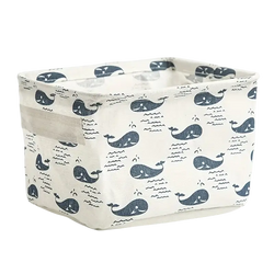 Foldable white fabric storage basket with navy blue whale print designed as a decorative storage box