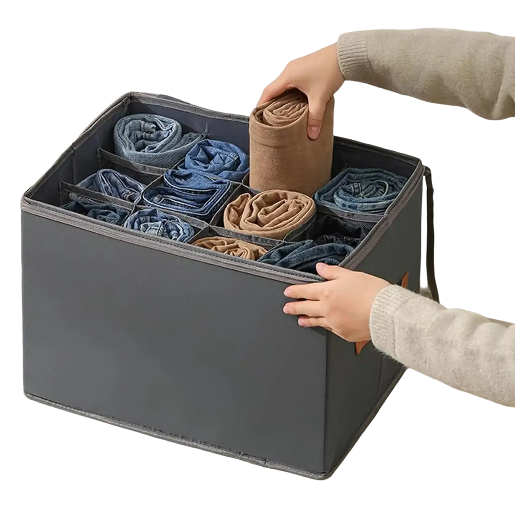 Foldable gray fabric shoe organizer with divided compartments holding rolled jeans and socks for closet storage
