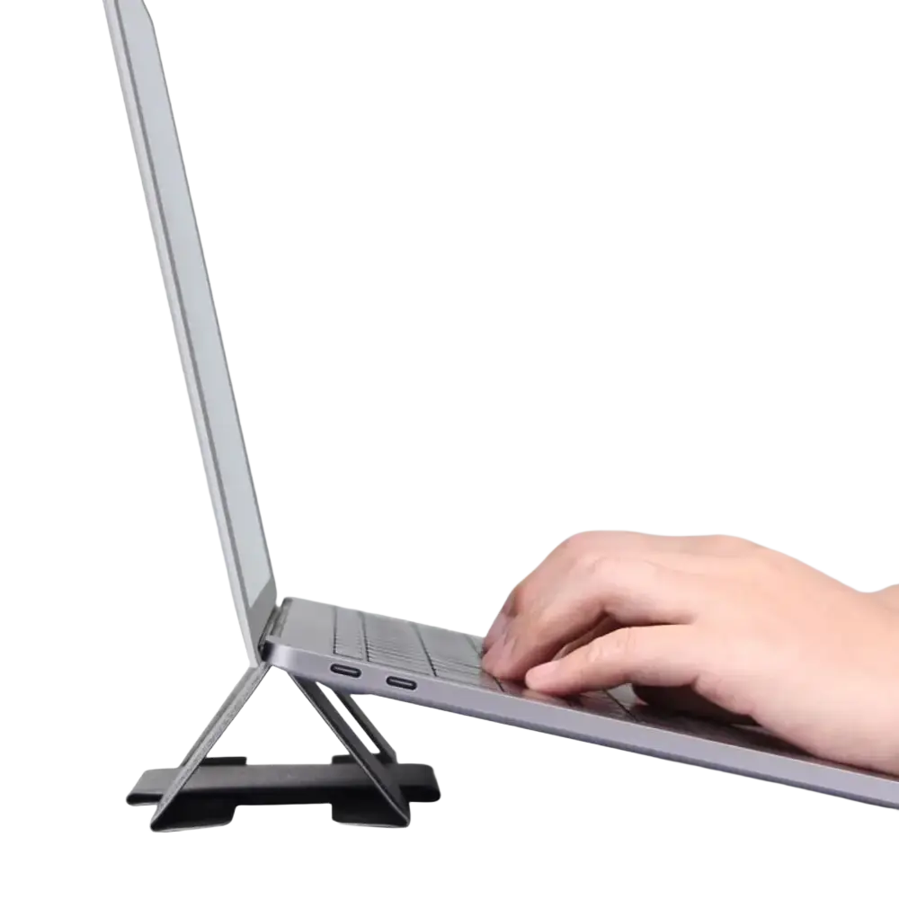 Black foldable aluminum laptop stand supporting a silver laptop for 12 to 16 inch notebooks use