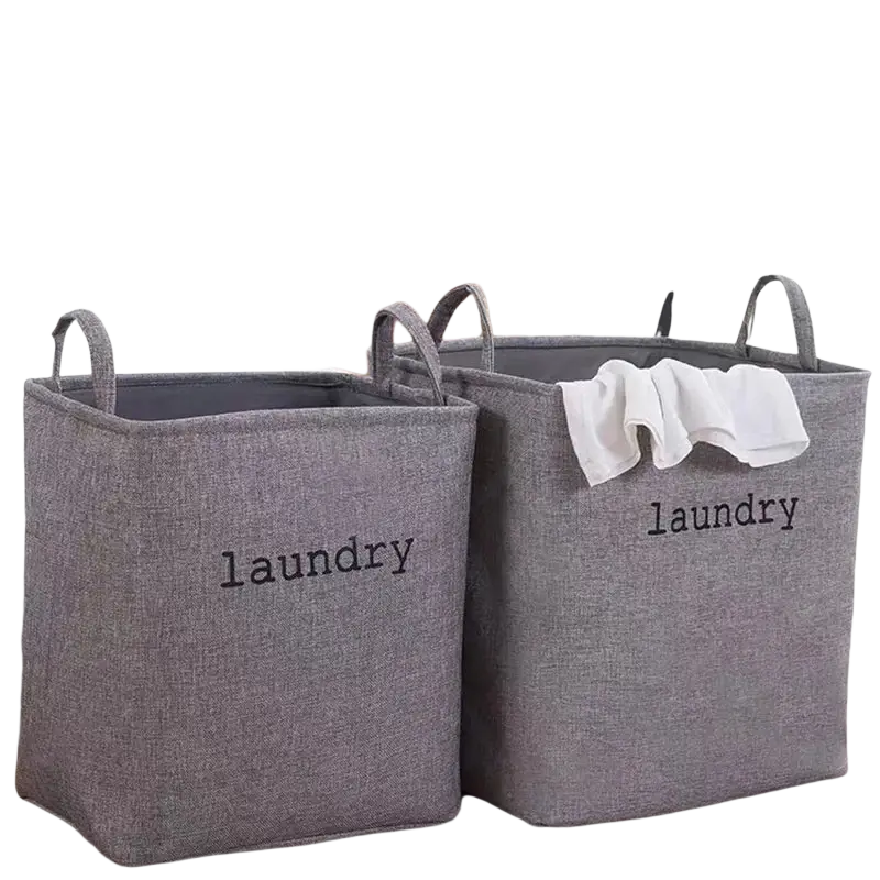 Gray fabric foldable laundry basket with black laundry lettering and looped handles for storage baskets use