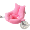 Pink plush foldable newborn bath mat and cushion with soft fabric and adjustable gray straps for baby support