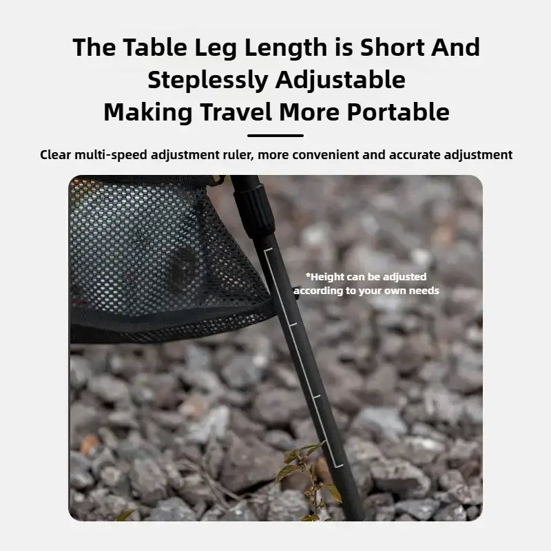 Black adjustable table leg with mesh netting attachment on foldable round aluminum alloy camping table
