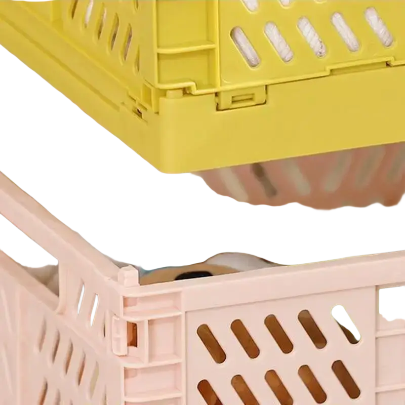 A pale pink plastic foldable storage basket with a lattice design and visible interlocking hinges