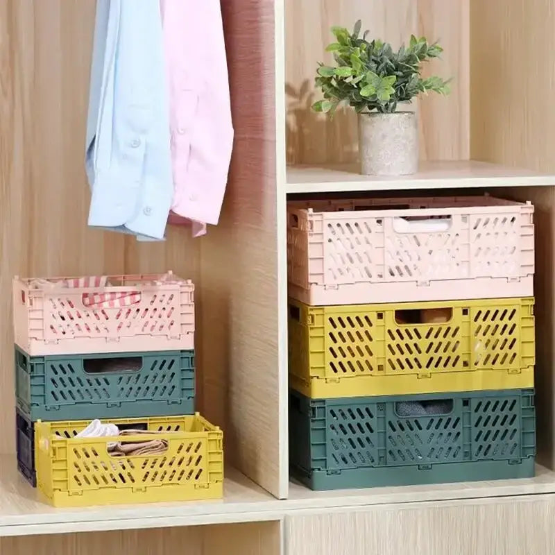 Stacked pastel-colored foldable storage baskets made of plastic with a perforated design for easy folding and stacking