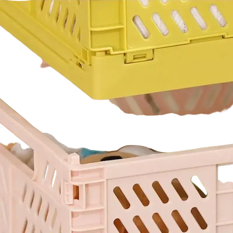 A yellow plastic foldable storage basket with perforated design and interlocking panels for stackable storage