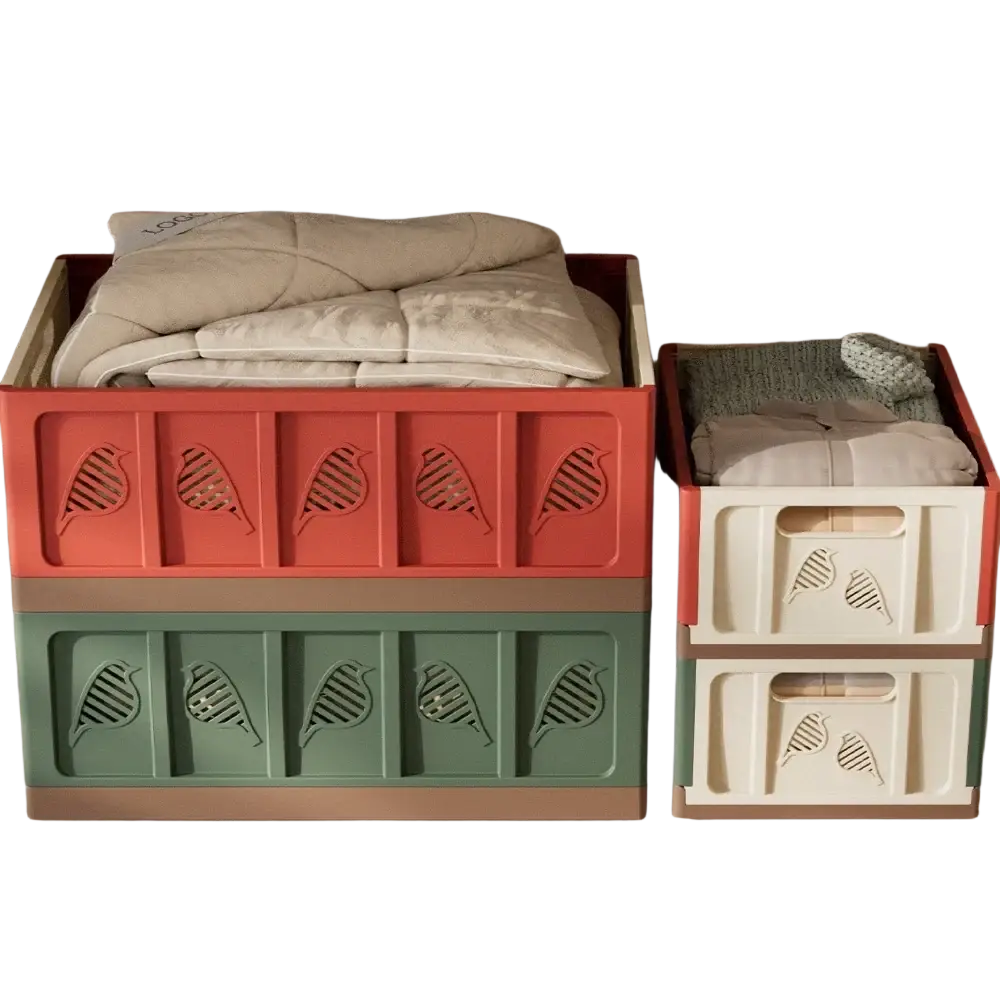 Stacked foldable storage plastic bins in coral and sage green with bird cutouts and beige lining showing actual goods