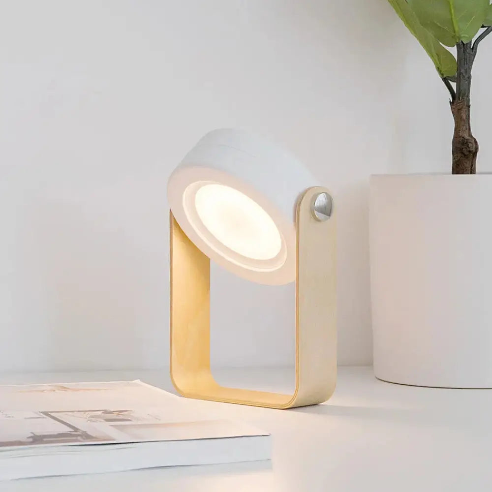 Minimalist white and light wood foldable touch dimmable LED lantern and portable table lamp with sleek modern design