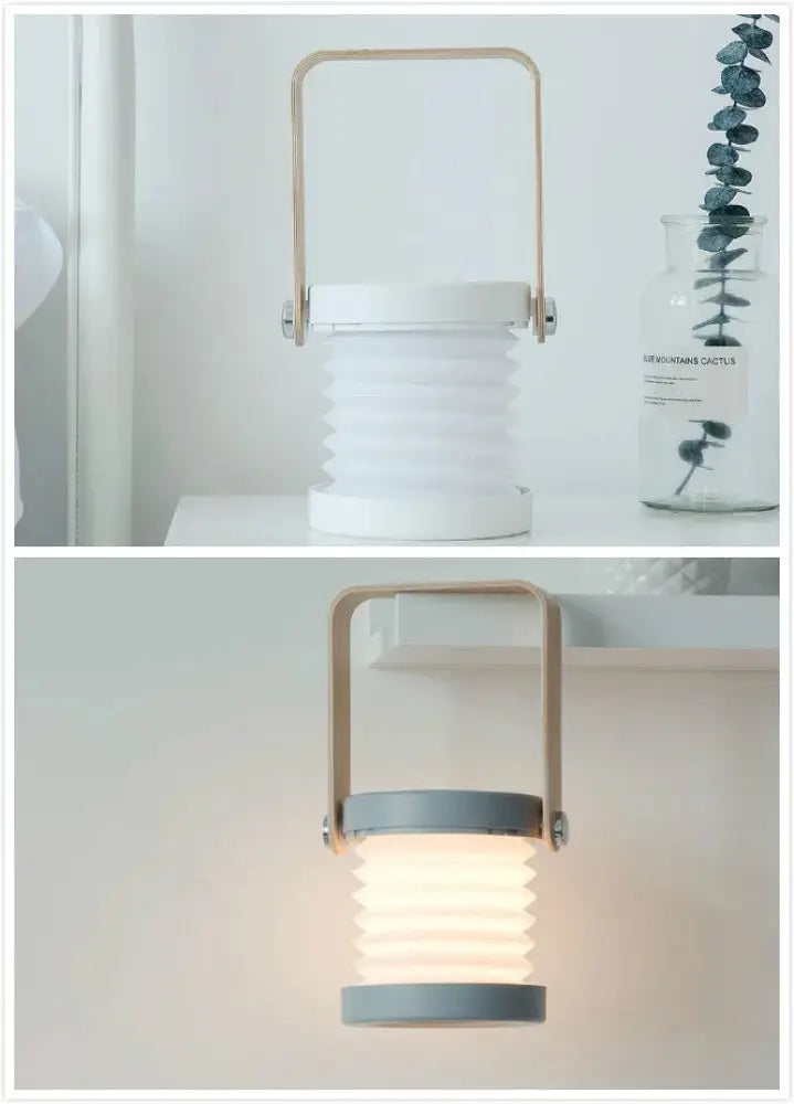 White foldable touch dimmable led lantern with gold-toned metal handle and gray accents for indoor and outdoor use