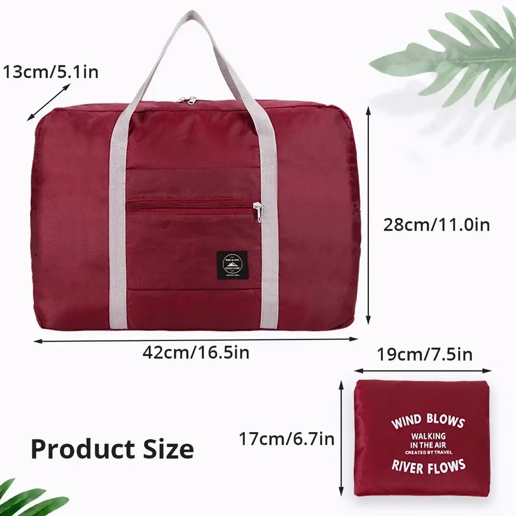 Maroon foldable travel duffel bag with gray fabric handles and front zippered pocket for large women luggage