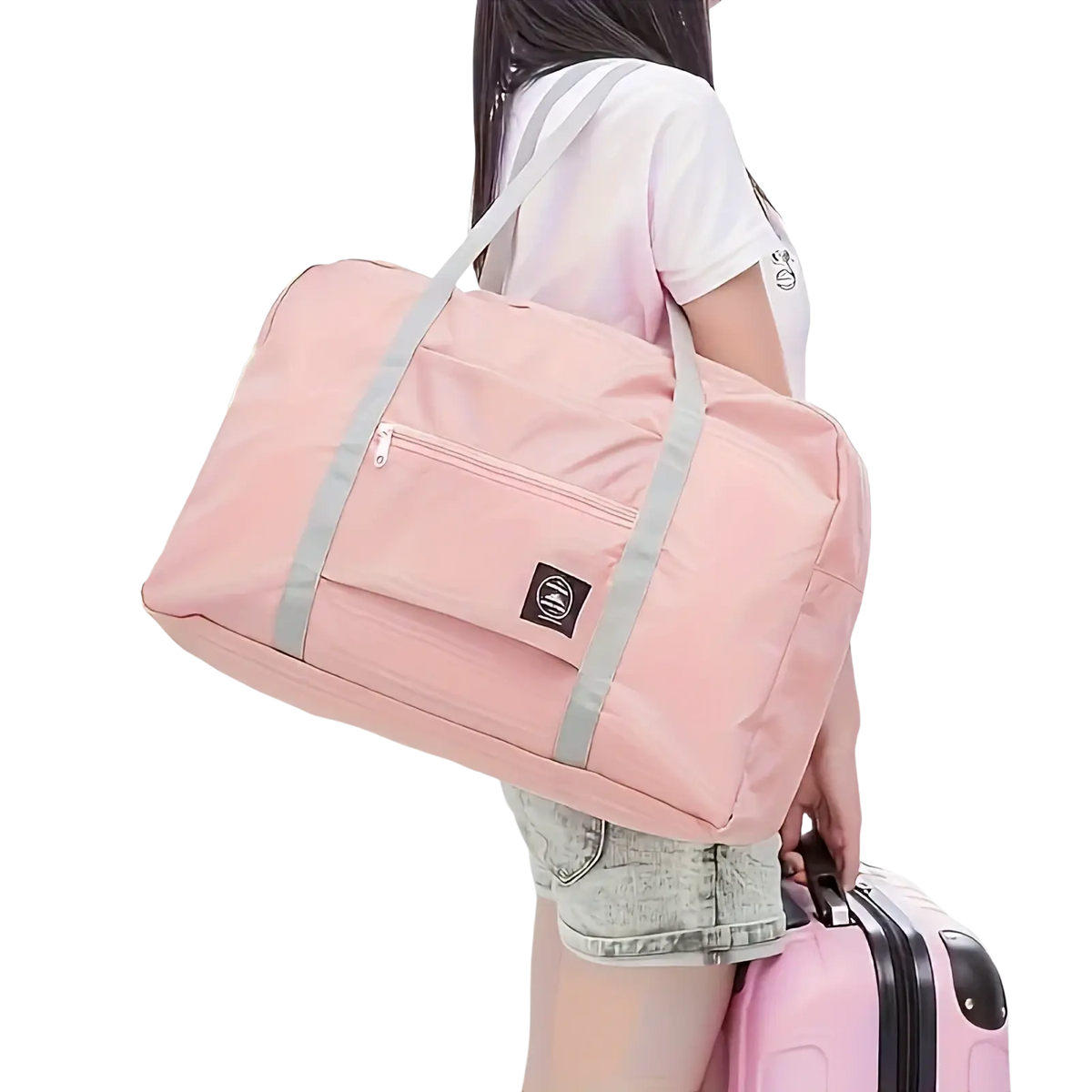Foldable travel duffel bag lightweight carry in pink fabric with gray straps and a small black logo patch