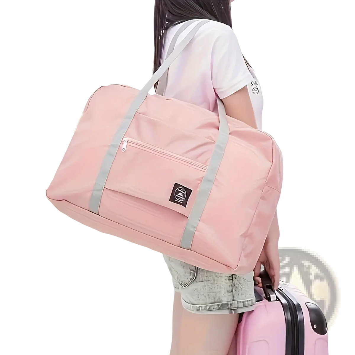 Foldable travel duffel bag lightweight carry in pink fabric with gray straps and a small black logo patch