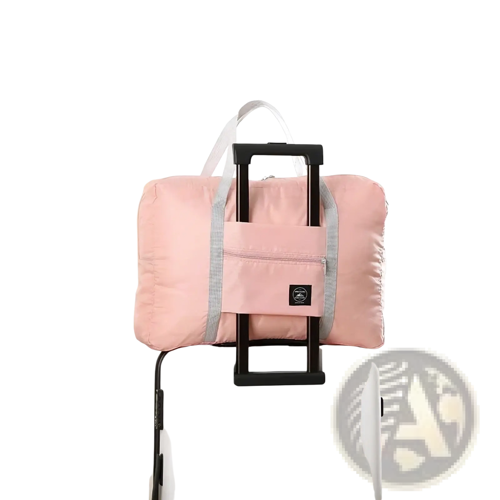 Foldable travel duffel bag lightweight carry in pink with gray trim and black handle attachment for easy portability