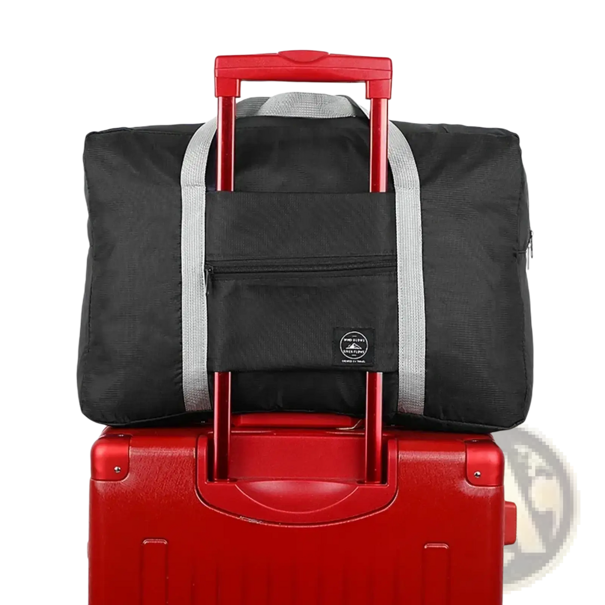 Black foldable travel duffel bag with red retractable handle and gray striped straps for waterproof luggage use