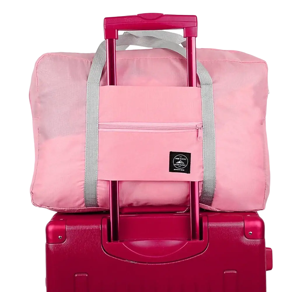 Pink foldable travel duffel bag with gray straps retractable handle front zippered pocket waterproof luggage tote