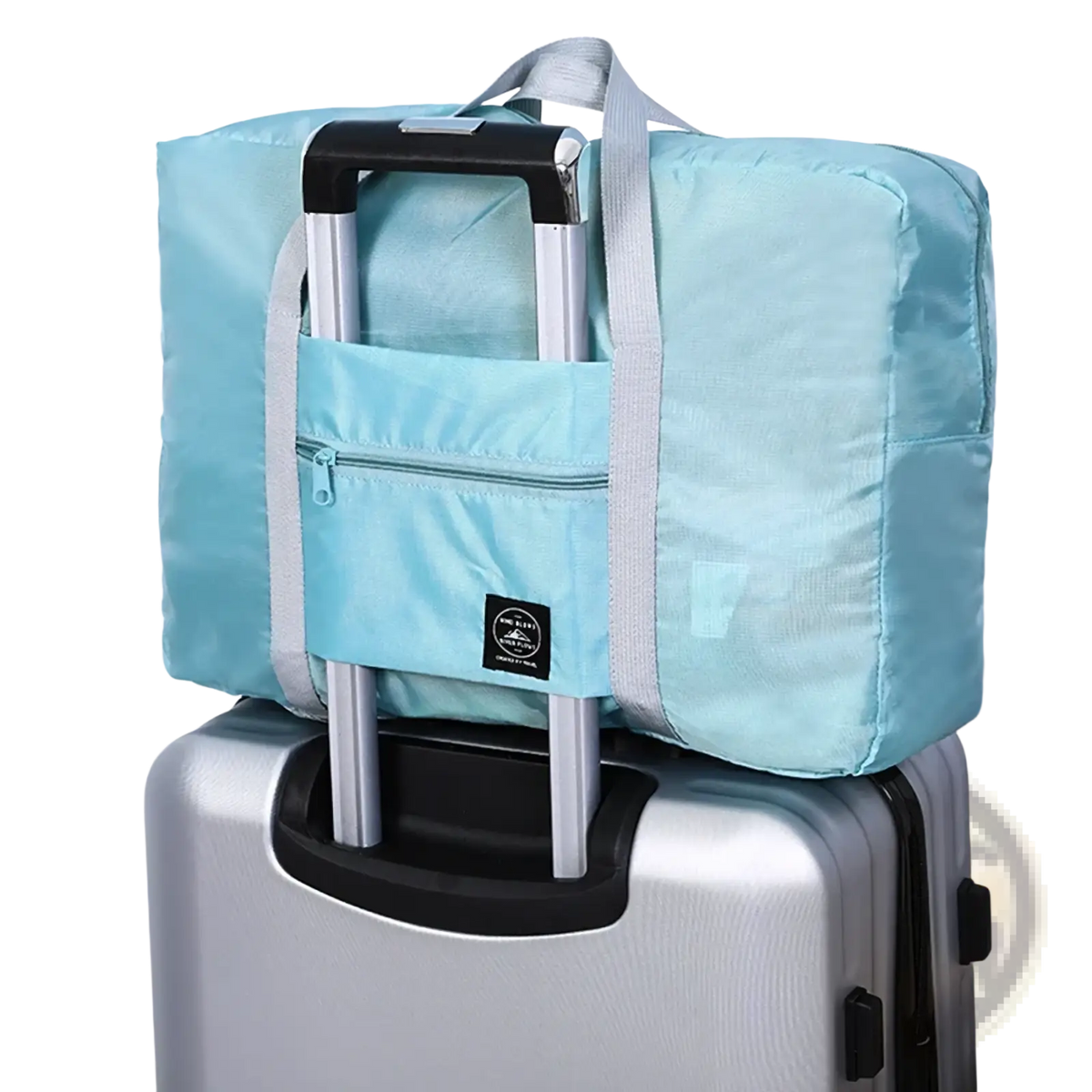 Light blue foldable travel duffle bag with gray straps and front zippered pocket made of lightweight nylon tote