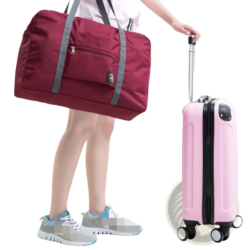 Foldable travel duffle bag lightweight nylon tote in maroon with gray reinforced straps and a small black logo patch