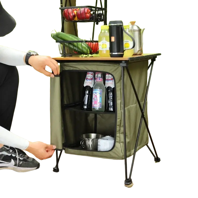 Folding camping storage cabinet and table in olive green fabric with black metal frame and foldable legs