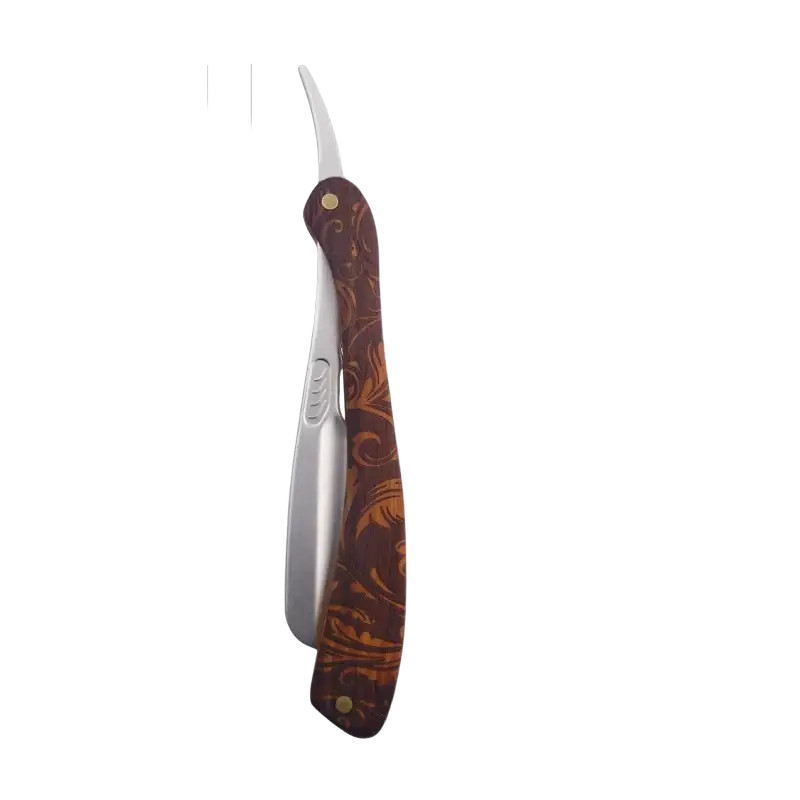 Brown leather-handled folding razor with ornate gold leaf pattern and silver blade shown with replacement blade