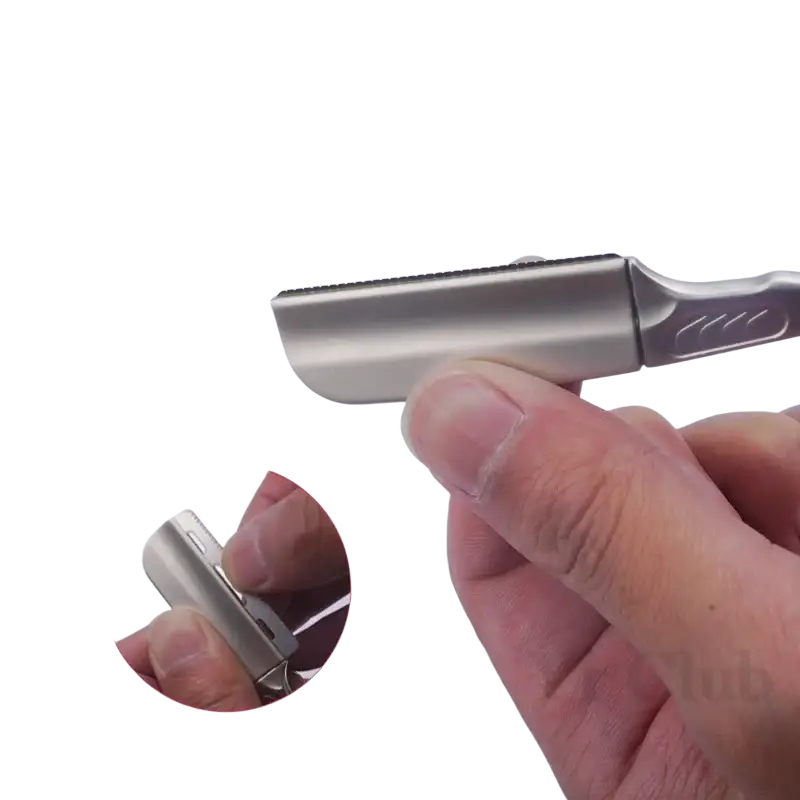 Silver metallic folding razor with sleek ergonomic handle and fine-toothed blade for precise shaving tool use