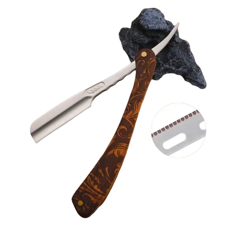 Folding razor with a polished silver blade and ornate dark brown wooden handle featuring gold floral inlays