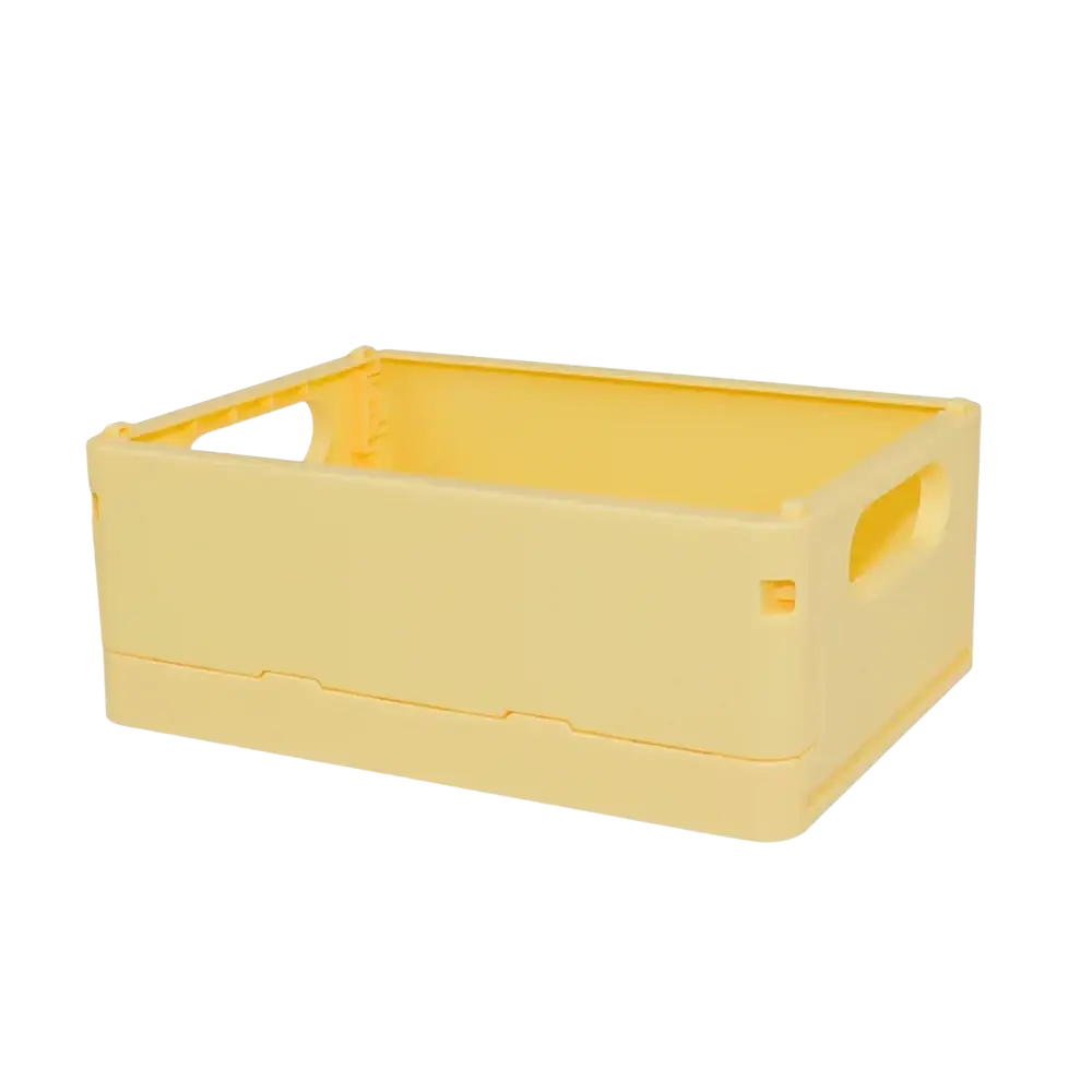 A compact pale yellow plastic folding storage box with integrated handles for desktop organization and storage basket use