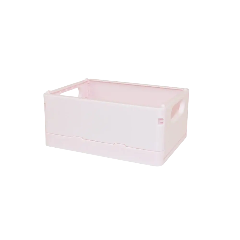 A light pink foldable plastic storage box with integrated handles and minimalist design for desktop organization
