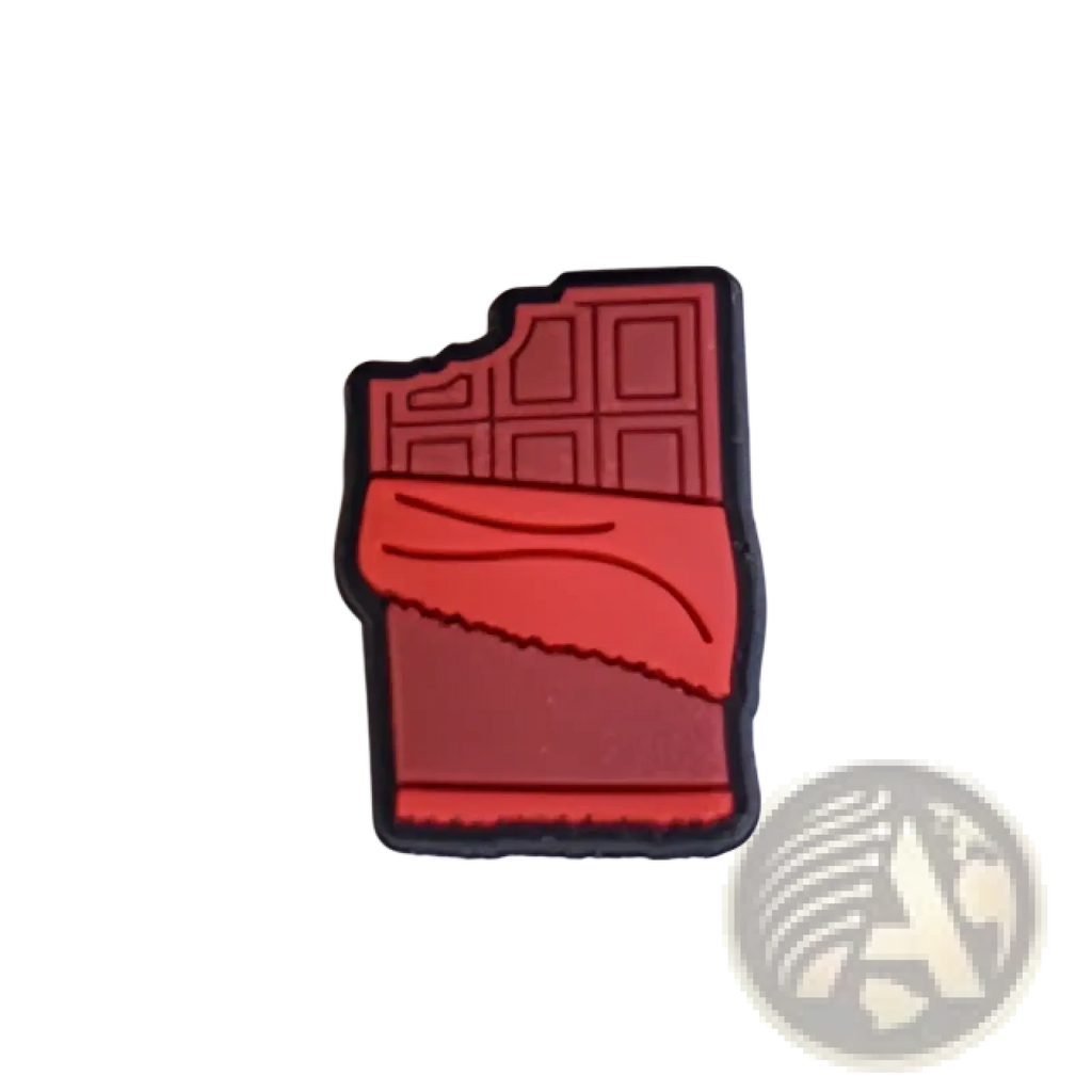 Red chocolate bar shaped food themed shoe charm with black outline and textured surface for sandals and clogs