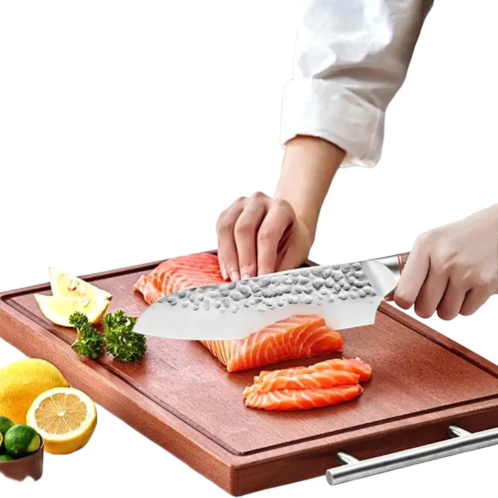 A sleek hammered stainless steel chef knife with a polished handle rests on a cutting board beside sliced salmon