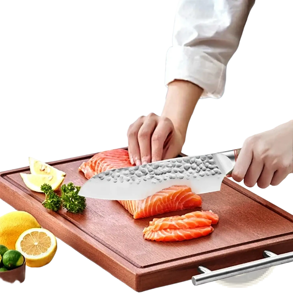 A sleek hammered stainless steel chef knife with a polished handle rests on a cutting board beside sliced salmon